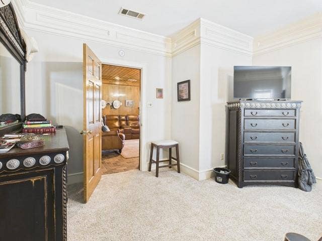 2382 Crystal Drive, Athens, TX 75752 Bedroom with carpet flooring and crown molding