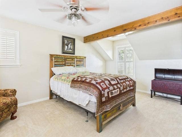 2382 Crystal Drive, Athens, TX 75752 Carpeted bedroom featuring baseboards and a ceiling fan