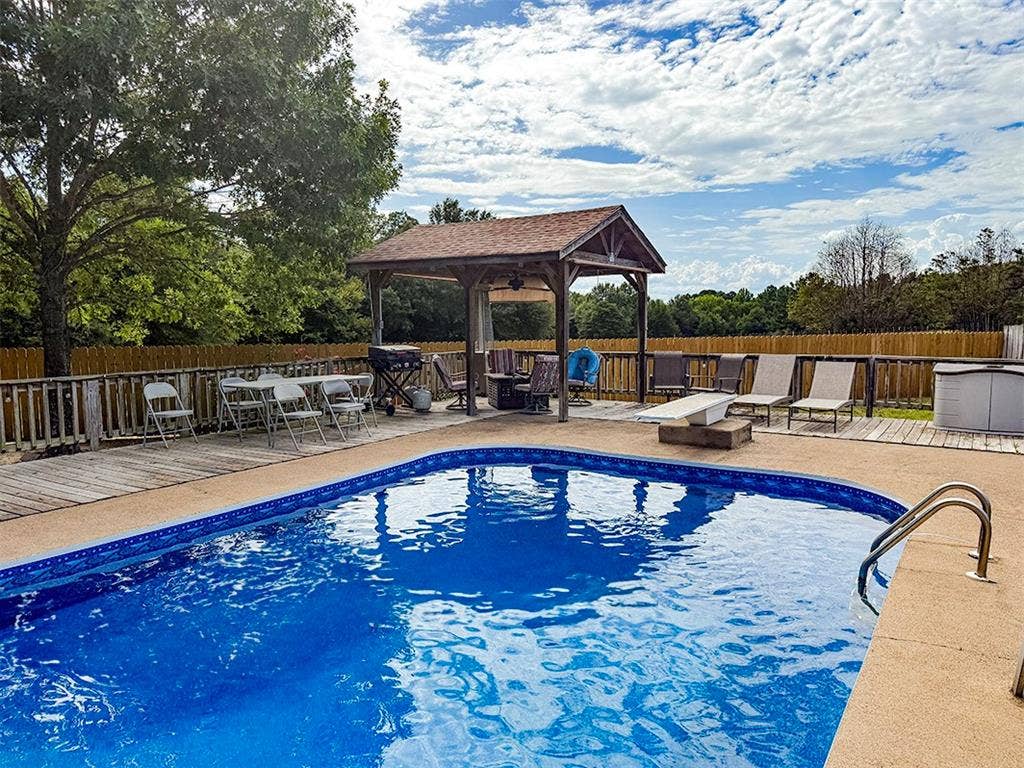 2382 Crystal Drive, Athens, TX 75752 View of pool featuring a gazebo, a fenced backyard, and a wooden deck