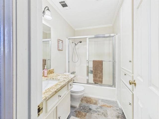 2382 Crystal Drive, Athens, TX 75752 Full bath with vanity, combined bath / shower with glass door, crown molding, and stone finish floors