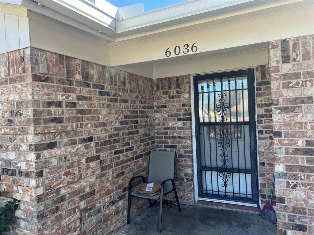 6036 Harrison Way, Watauga, TX 76148 Doorway to property with brick siding