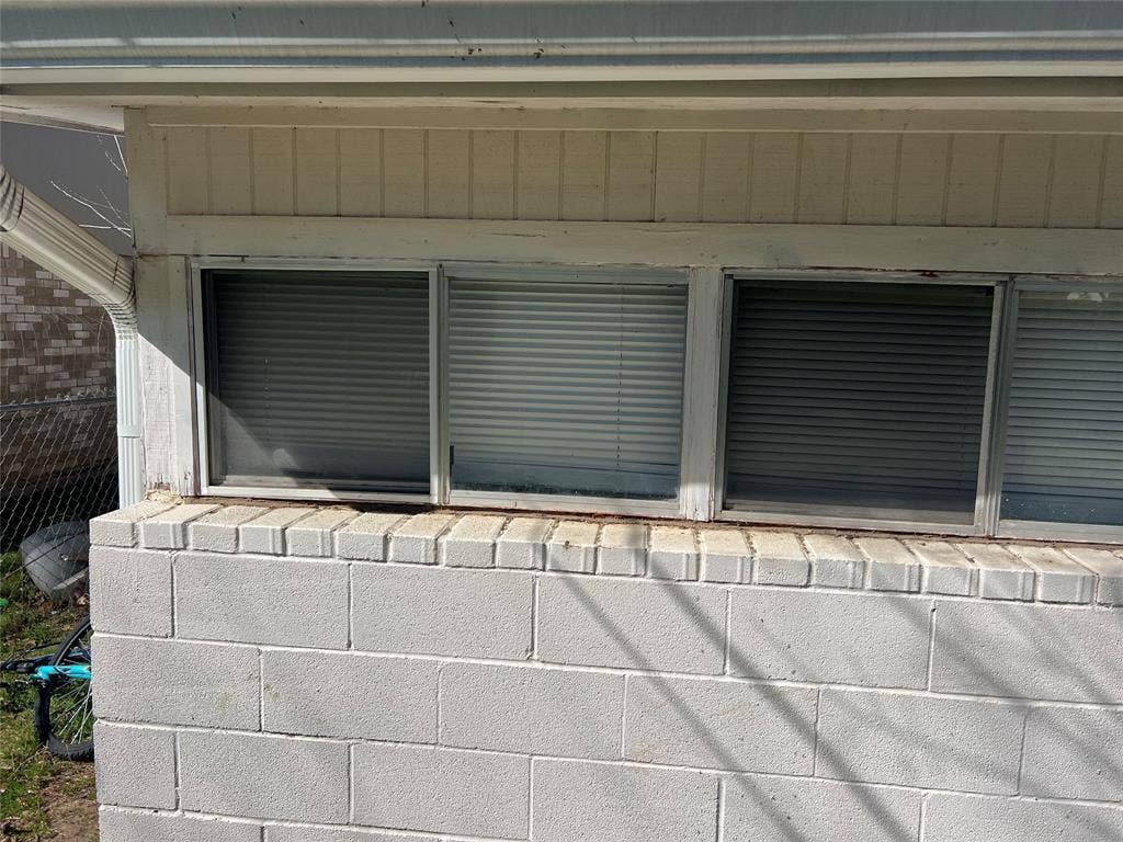 6036 Harrison Way, Watauga, TX 76148 Exterior view of concrete block siding