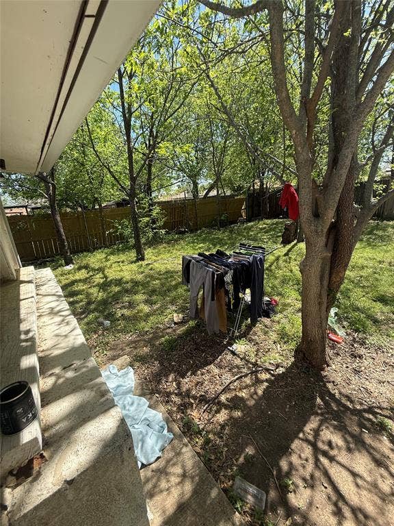 6036 Harrison Way, Watauga, TX 76148 Fenced backyard featuring a patio
