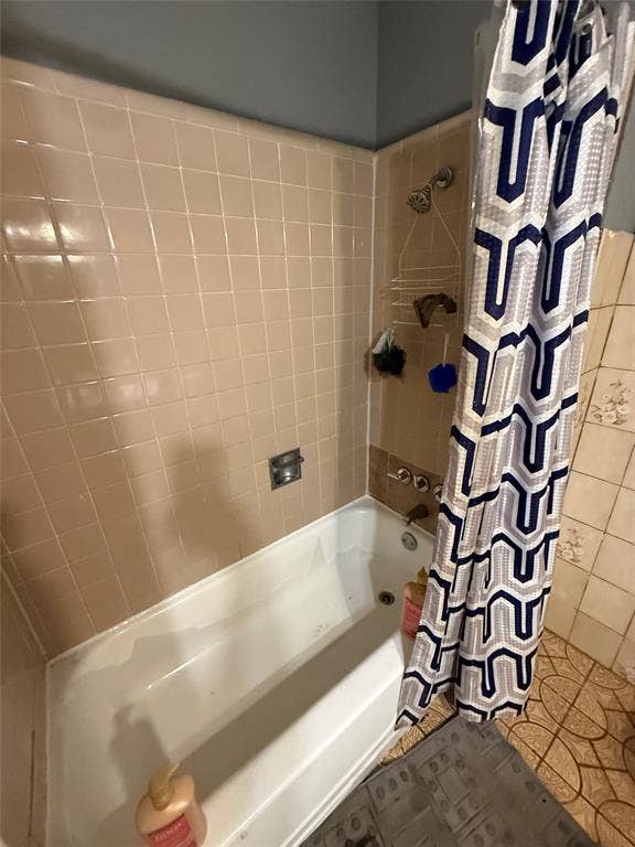 6036 Harrison Way, Watauga, TX 76148 Full bathroom featuring tile patterned flooring and shower / tub combo