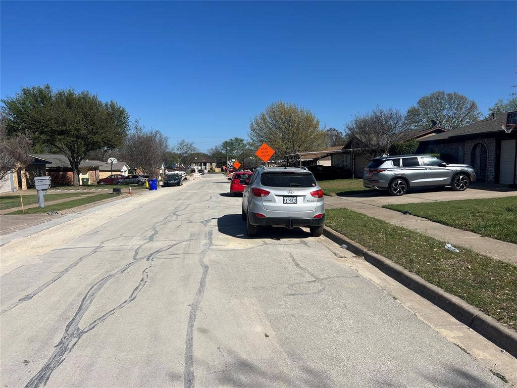 6036 Harrison Way, Watauga, TX 76148 View of asphalt road with sidewalks, curbs, and a residential view