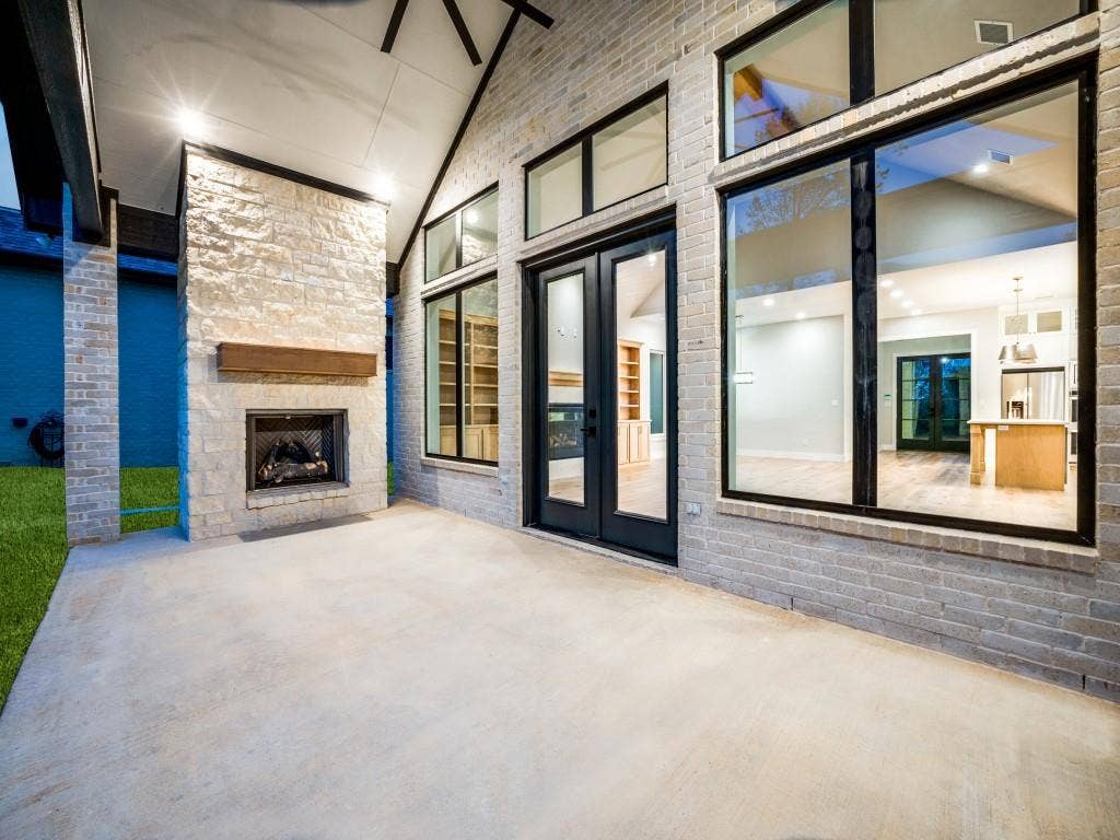 4585 Cascades Boulevard, Tyler, TX 75709 Covered back patio with gas log fireplace