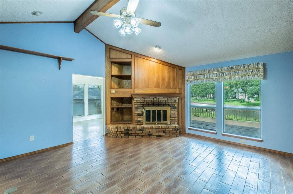 27 Sundown Trail, Star Harbor, TX 75148 Living room on lake side on home. Come see the great view!