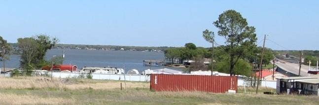 view of Cedar Creek Lake from front yard, porch, firepit, & gazebo.