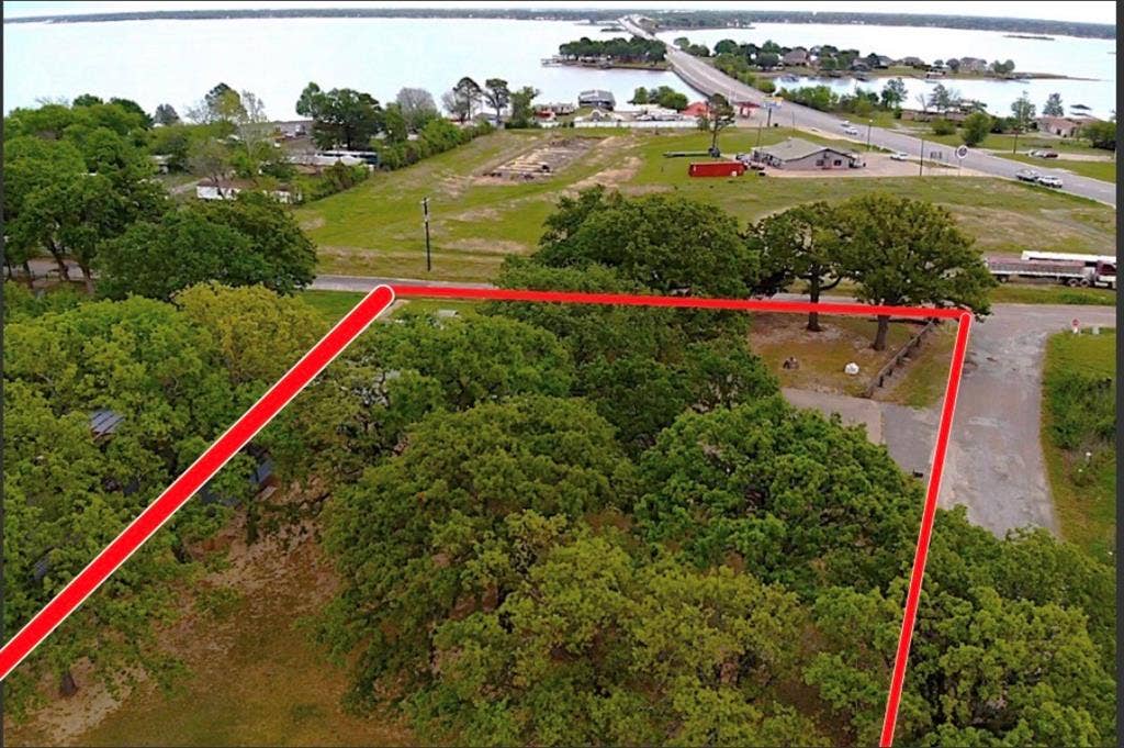 You'll have the biggest view of Cedar Creek Lake from your from porch here at 205 Mason, Seven Points, TX