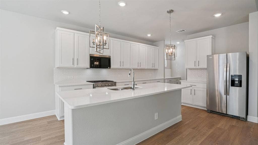 1410 Winters Way, Princeton, TX 75071 Photo is not of the actual home, but is an inspirational photo of builder’s model home and may depict options, furnishings, and/or decorator features that are not included.