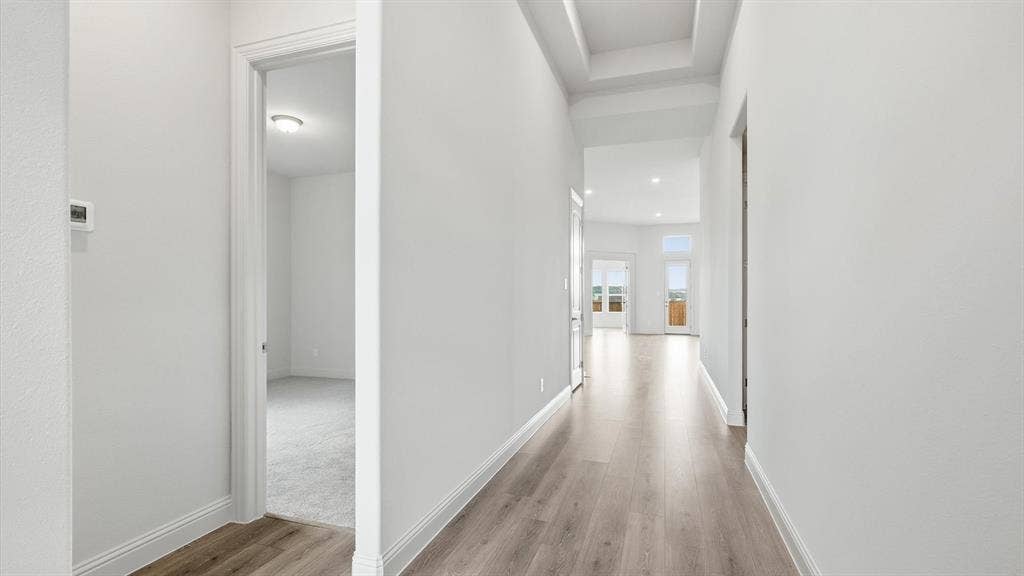 331 Fire Blade Drive, Aledo, TX 76008 Hallway with wood-finish flooring extending into a bright interior space