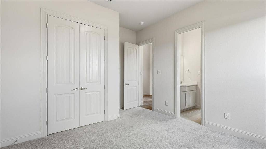 331 Fire Blade Drive, Aledo, TX 76008 Light grey carpeting with white baseboards throughout