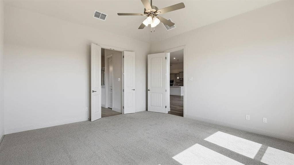 331 Fire Blade Drive, Aledo, TX 76008 Carpeted room featuring a ceiling fan with integrated lighting, white walls, and white trim