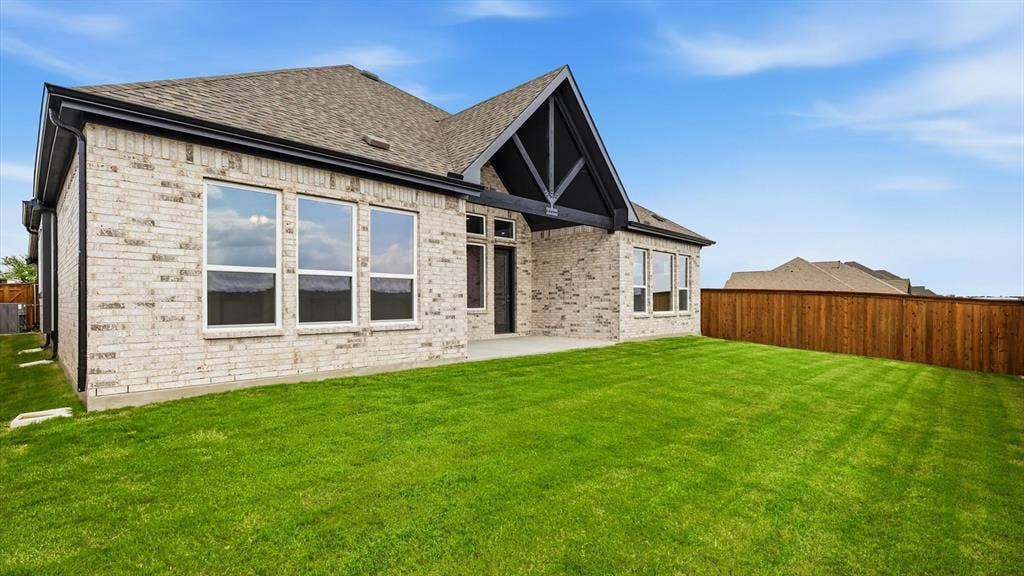 331 Fire Blade Drive, Aledo, TX 76008 Expansive green lawn with a newly constructed brick exterior