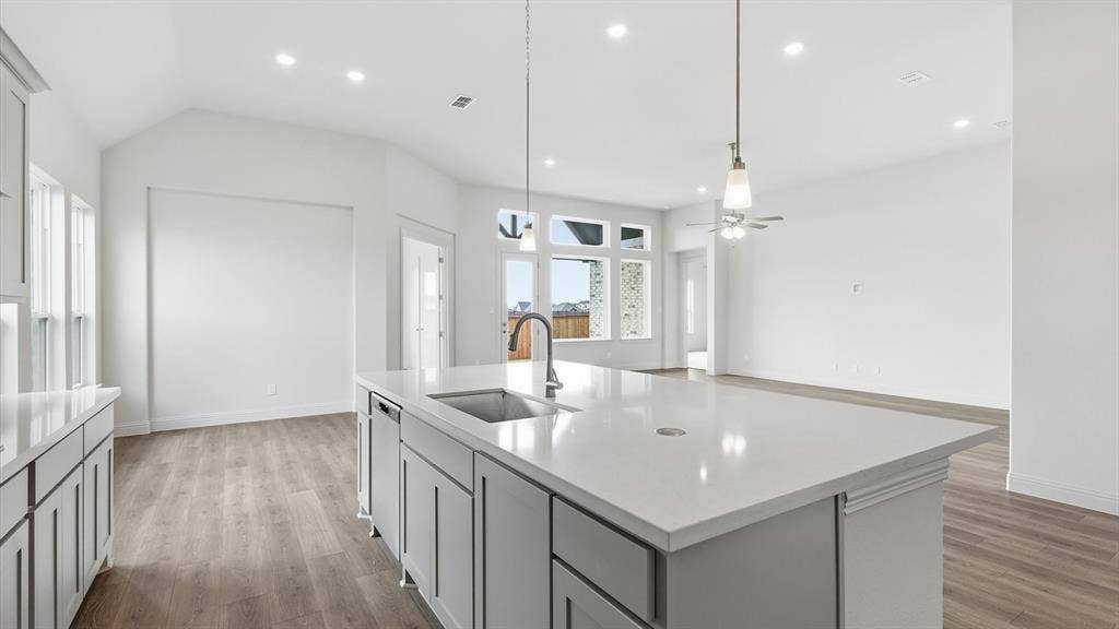 331 Fire Blade Drive, Aledo, TX 76008 Kitchen island with an undermount sink and gooseneck faucet