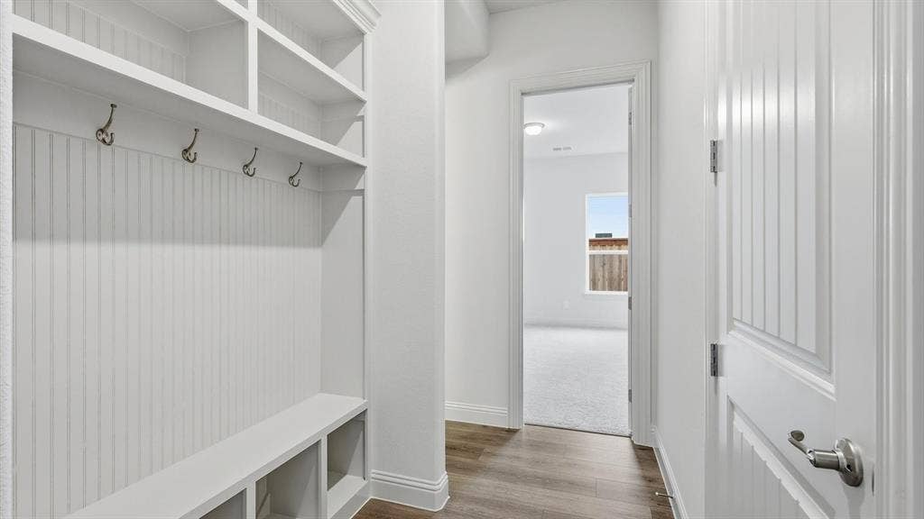 331 Fire Blade Drive, Aledo, TX 76008 Built-in mudroom bench with cubby storage, upper shelving, and coat hooks