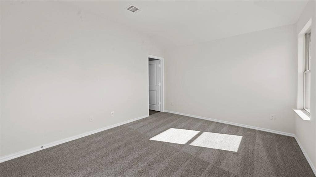 1635 Blaire Drive, Tyler, TX 75702 Unfurnished room with carpet floors and vaulted ceiling