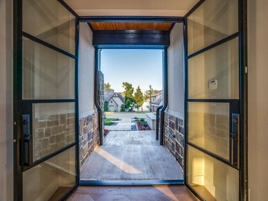 2424 Bellview Circle, Tyler, TX 75709 Metal and glass double doors welcome you
