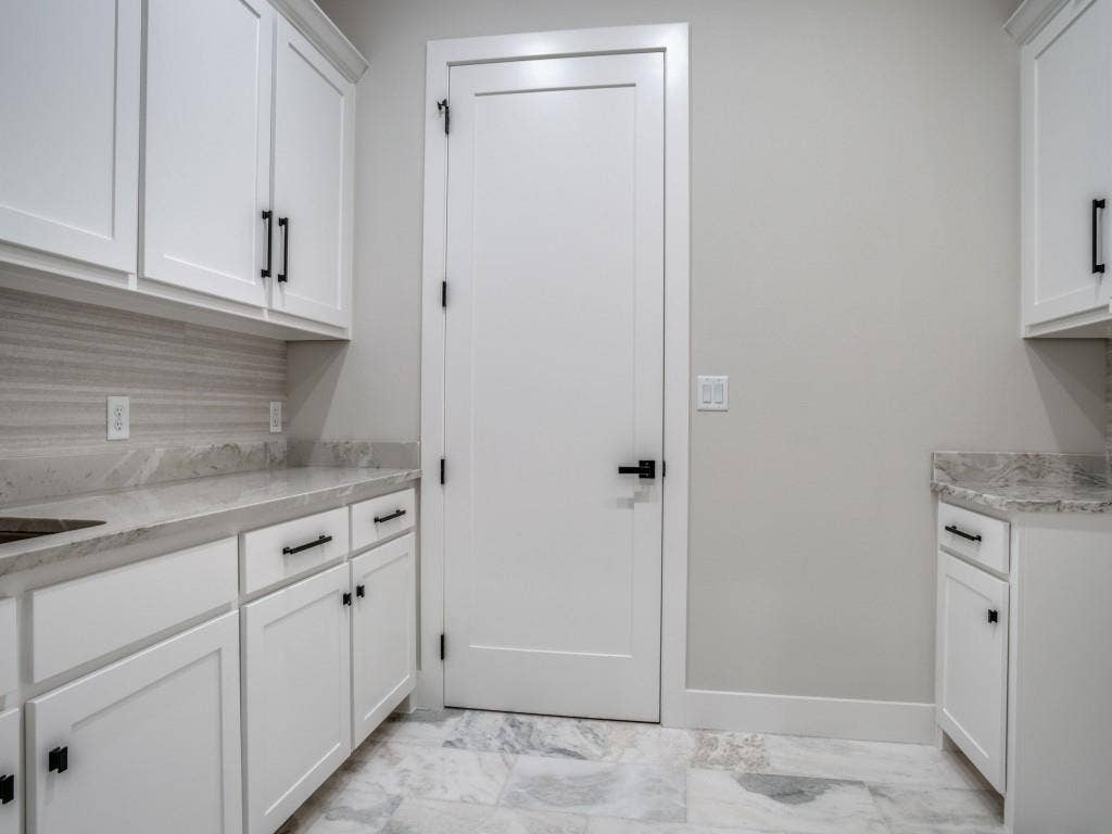 2424 Bellview Circle, Tyler, TX 75709 Polished marble floors and a utility sink