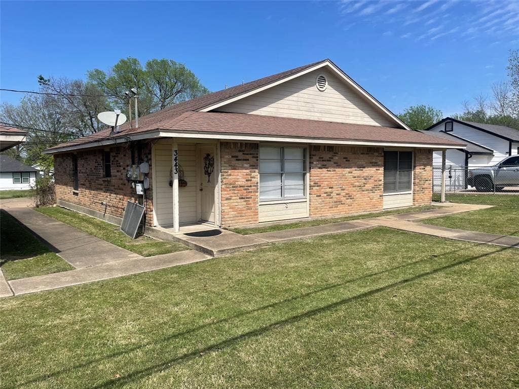3441 Pewitt Drive, #43, Waco, TX 76706 View of front of house with brick siding and a shingled roof