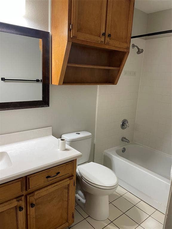3441 Pewitt Drive, #43, Waco, TX 76706 Bathroom featuring vanity, bathing tub / shower combination, and light tile patterned floors