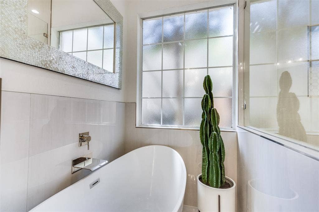 Relax and soak in this freestanding tub with waterfall faucet.