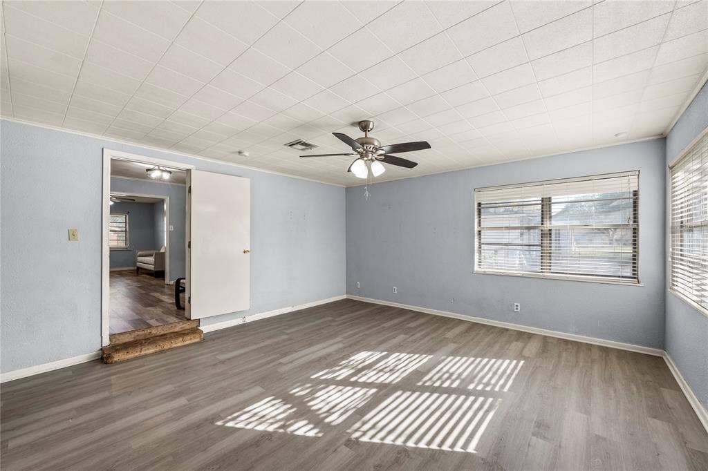 901 N Main Street, West, TX 76691 Spare room featuring plenty of natural light, wood finished floors, and ceiling fan