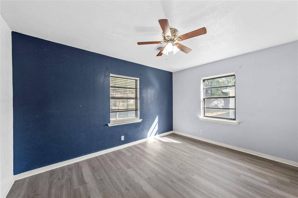 901 N Main Street, West, TX 76691 Unfurnished room with light wood finished floors, plenty of natural light, and ceiling fan