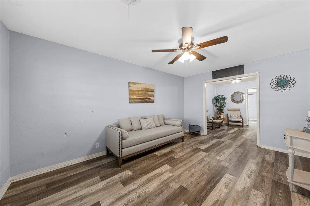 901 N Main Street, West, TX 76691 Living area featuring wood finished floors and ceiling fan