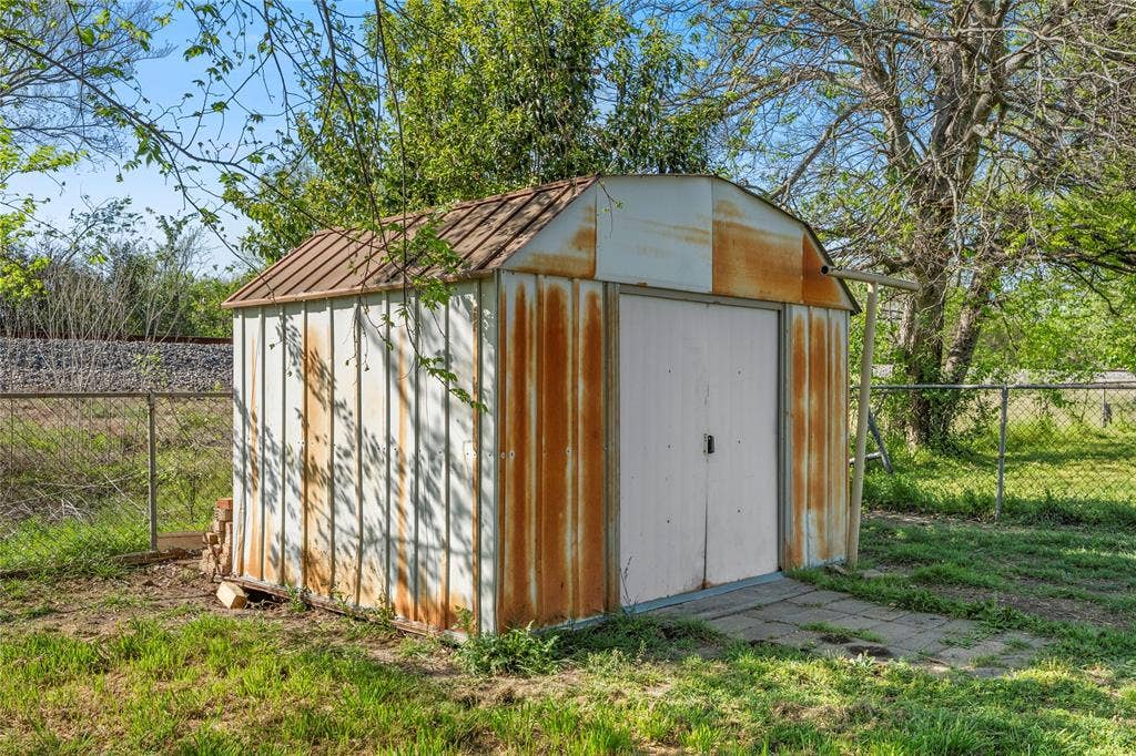 901 N Main Street, West, TX 76691 View of shed with a fenced backyard