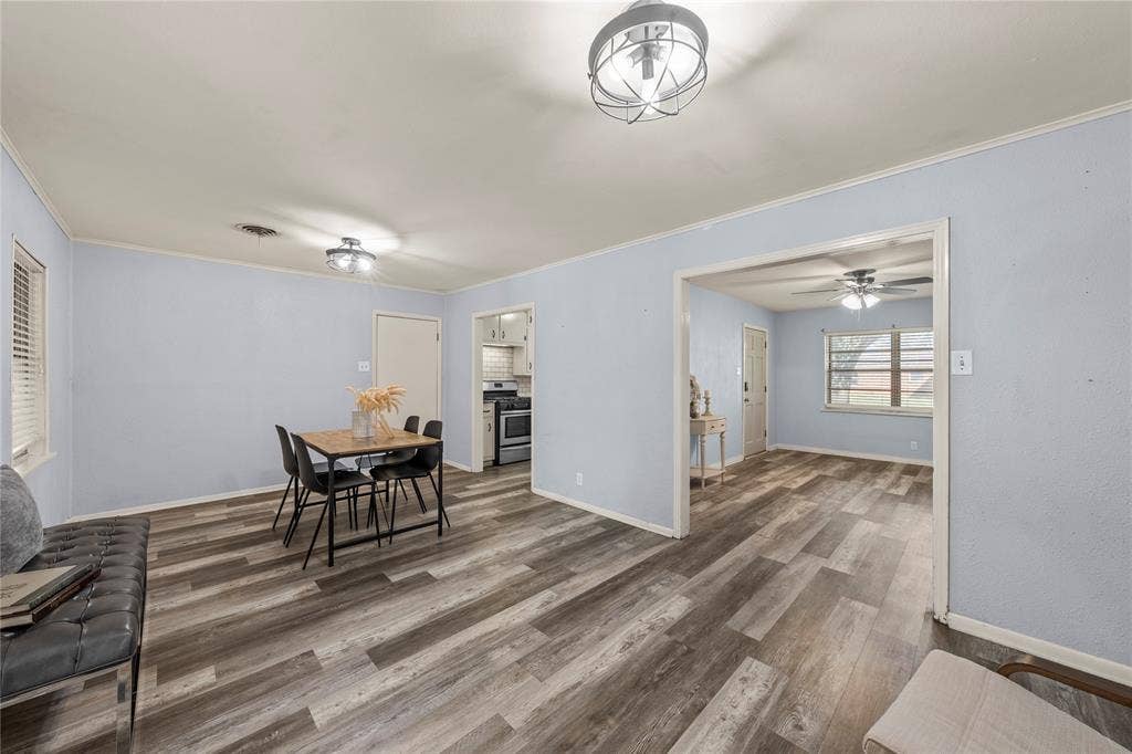 901 N Main Street, West, TX 76691 Dining space with wood finished floors, ornamental molding, and ceiling fan