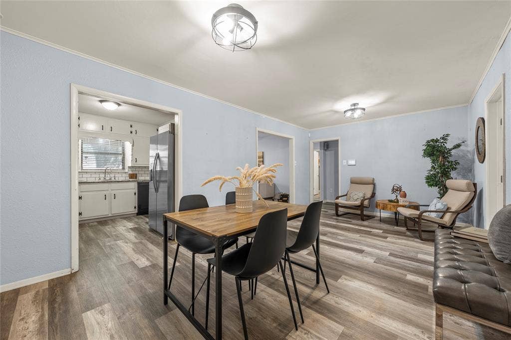 901 N Main Street, West, TX 76691 Dining room with ornamental molding and wood finished floors