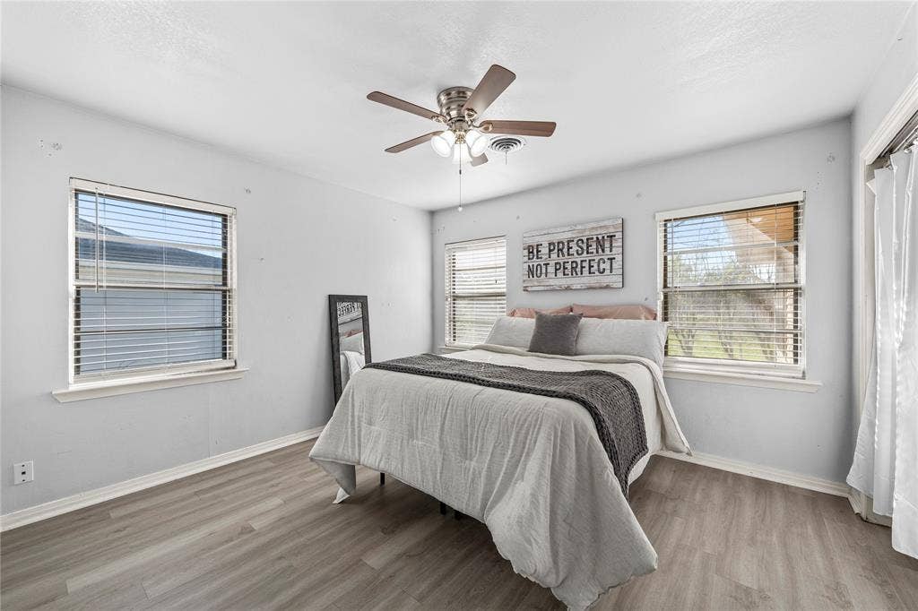 901 N Main Street, West, TX 76691 Bedroom featuring a ceiling fan and light wood-style floors