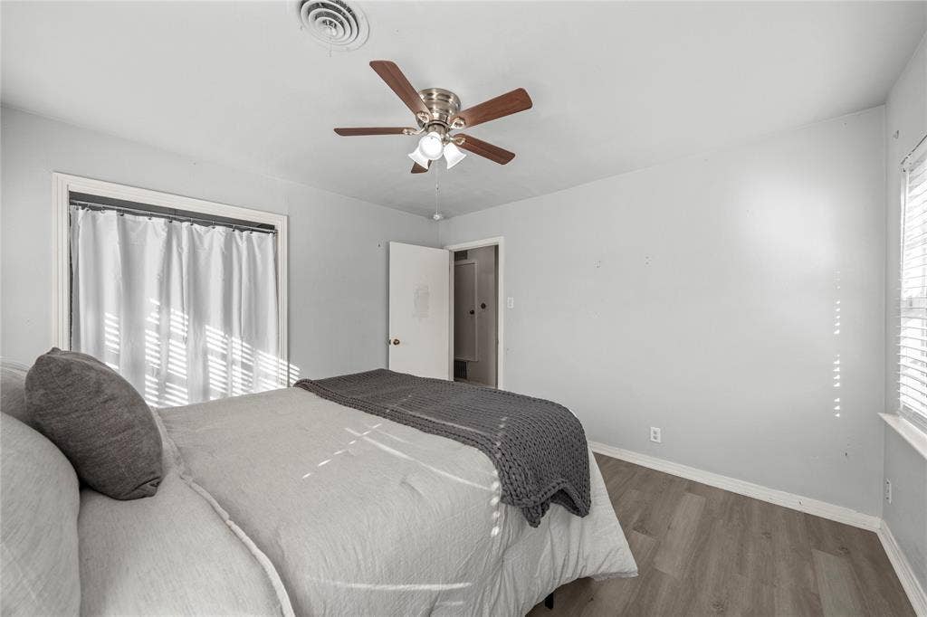 901 N Main Street, West, TX 76691 Bedroom with wood finished floors and ceiling fan