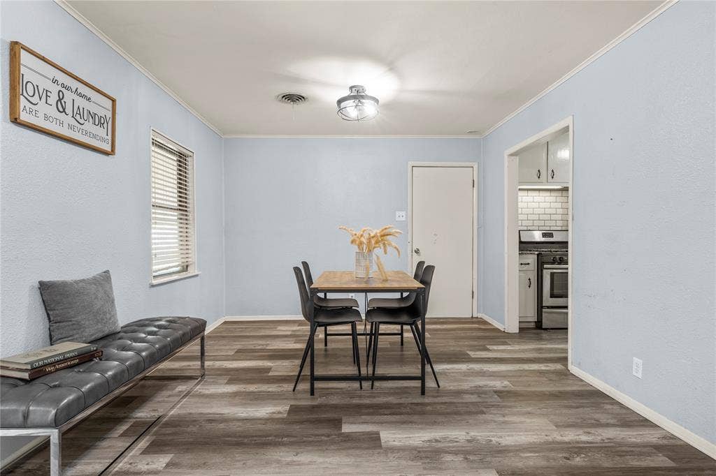 901 N Main Street, West, TX 76691 Dining area with crown molding and wood finished floors