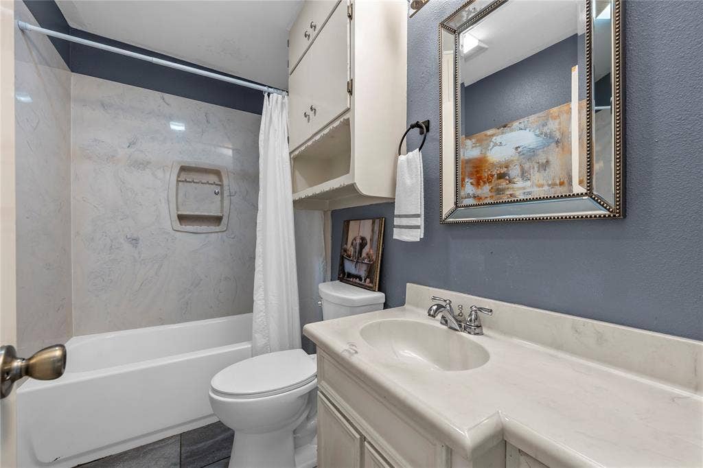 901 N Main Street, West, TX 76691 Bathroom with vanity and shower / tub combo