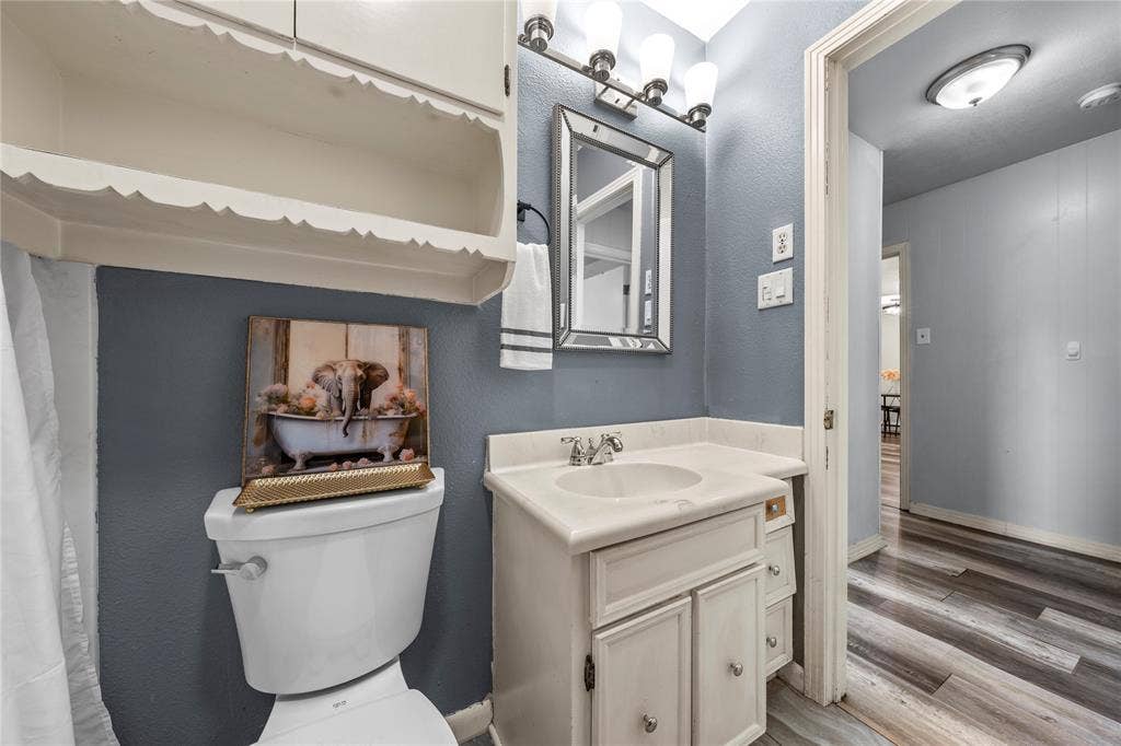 901 N Main Street, West, TX 76691 Bathroom with vanity and light wood-type flooring