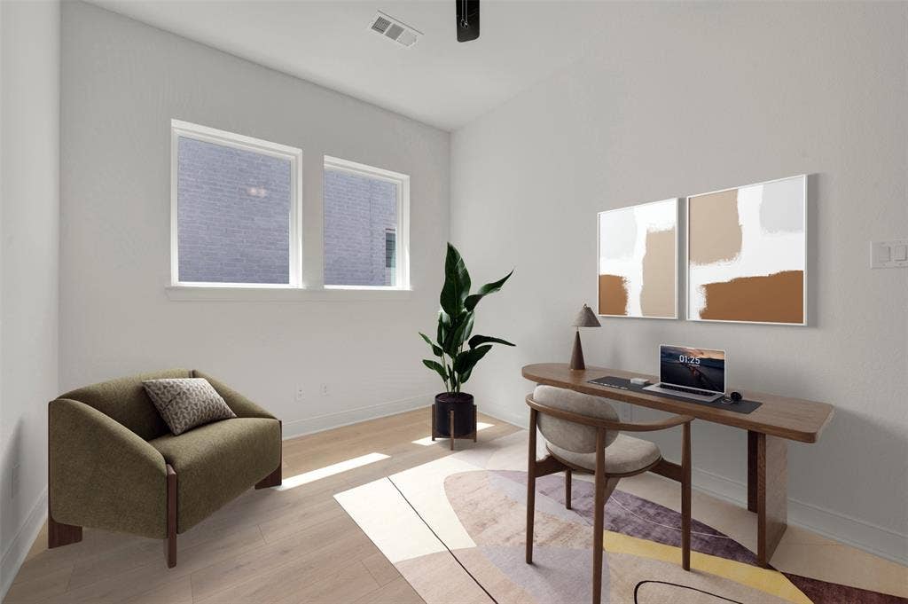 1709 Drover Street, Northlake, TX 76247 Light-filled interior space featuring two large windows, white walls, and wood-finish flooring