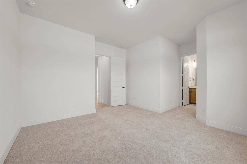 1709 Drover Street, Northlake, TX 76247 Spacious room featuring neutral carpeting, white walls, and bright overhead lighting