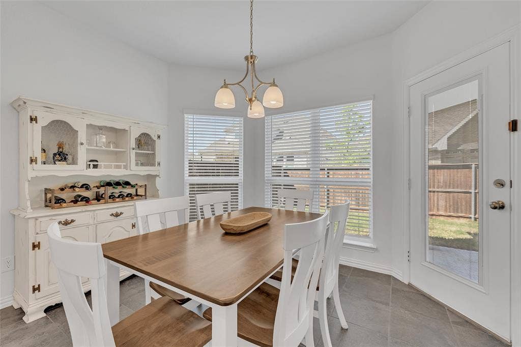 566 Long Meadow Drive, Haslet, TX 76052 Breakfast nook large enough for an 8 seater table and chairs. Currently showing 6 with room.