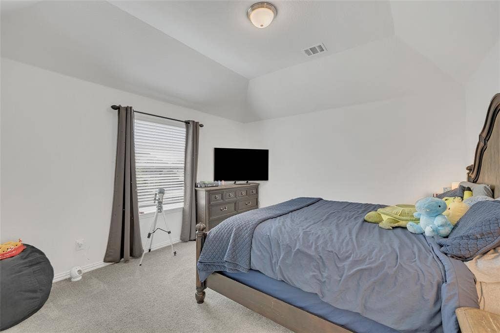 566 Long Meadow Drive, Haslet, TX 76052 Bedroom #5 and located on the 2nd floor. That IS a king sized bed, for reference.