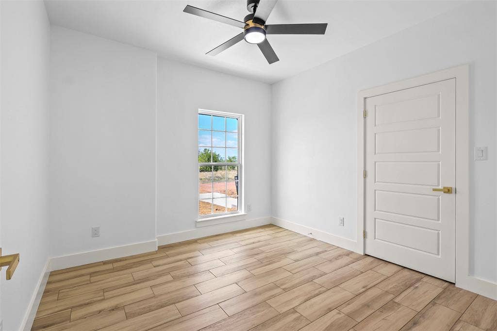 271 Victory Drive, Mabank, TX 75147 Spare room featuring wood finish floors and a ceiling fan