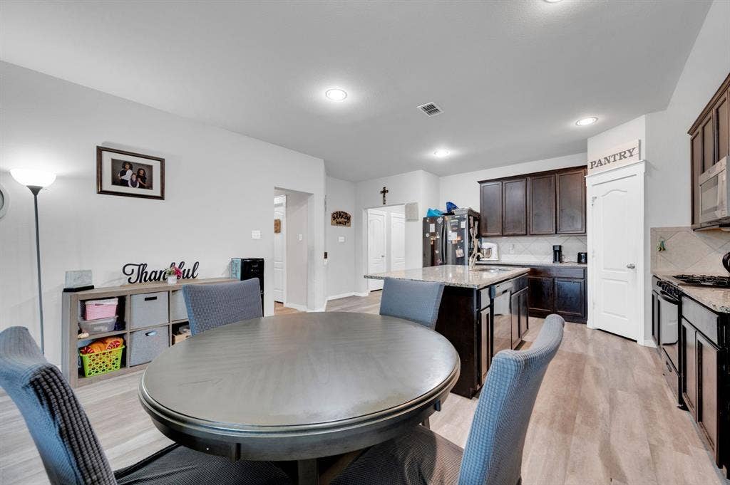 2609 Centurion Road, Glenn Heights, TX 75154 Dining space with light wood-style floors and recessed lighting