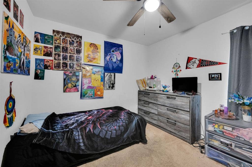 2609 Centurion Road, Glenn Heights, TX 75154 Bedroom with light colored carpet and a ceiling fan