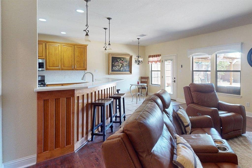 349 Creekside Trail, Argyle, TX 76226 Living area featuring hanging lights and light wood-style floors