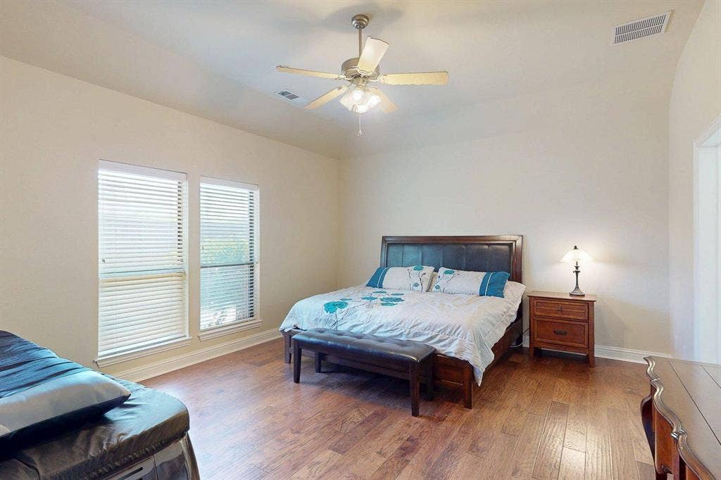 349 Creekside Trail, Argyle, TX 76226 Bedroom with wood-type flooring and ceiling fan