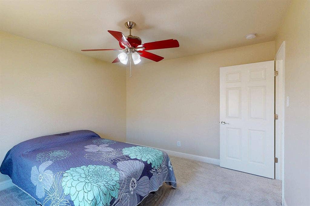 349 Creekside Trail, Argyle, TX 76226 Bedroom featuring light colored carpet and ceiling fan