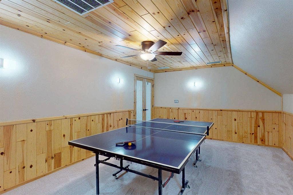 349 Creekside Trail, Argyle, TX 76226 Recreation room with wooden walls, carpet floors, wainscoting, ceiling fan, and a vaulted wooden ceiling