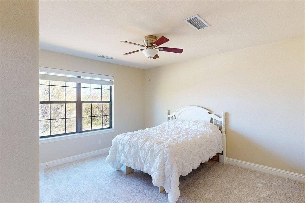 349 Creekside Trail, Argyle, TX 76226 Bedroom with ceiling fan and light colored carpet