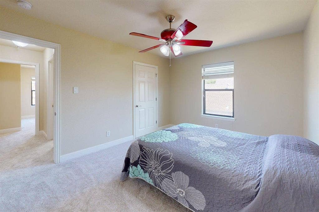 349 Creekside Trail, Argyle, TX 76226 Bedroom with light colored carpet and a ceiling fan